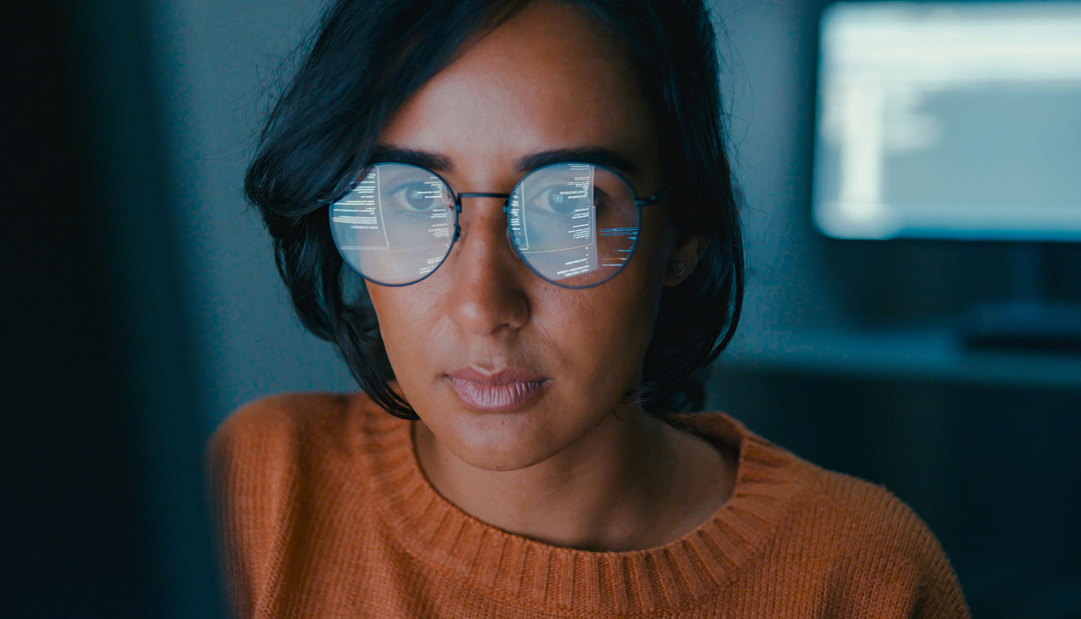 A developer is focused on a laptop screen displaying website performance metrics, analyzing key data such as the largest contentful paint (LCP) and other core web vitals. The screen shows graphs and figures that help diagnose performance issues, ensuring the web page loads efficiently for users.