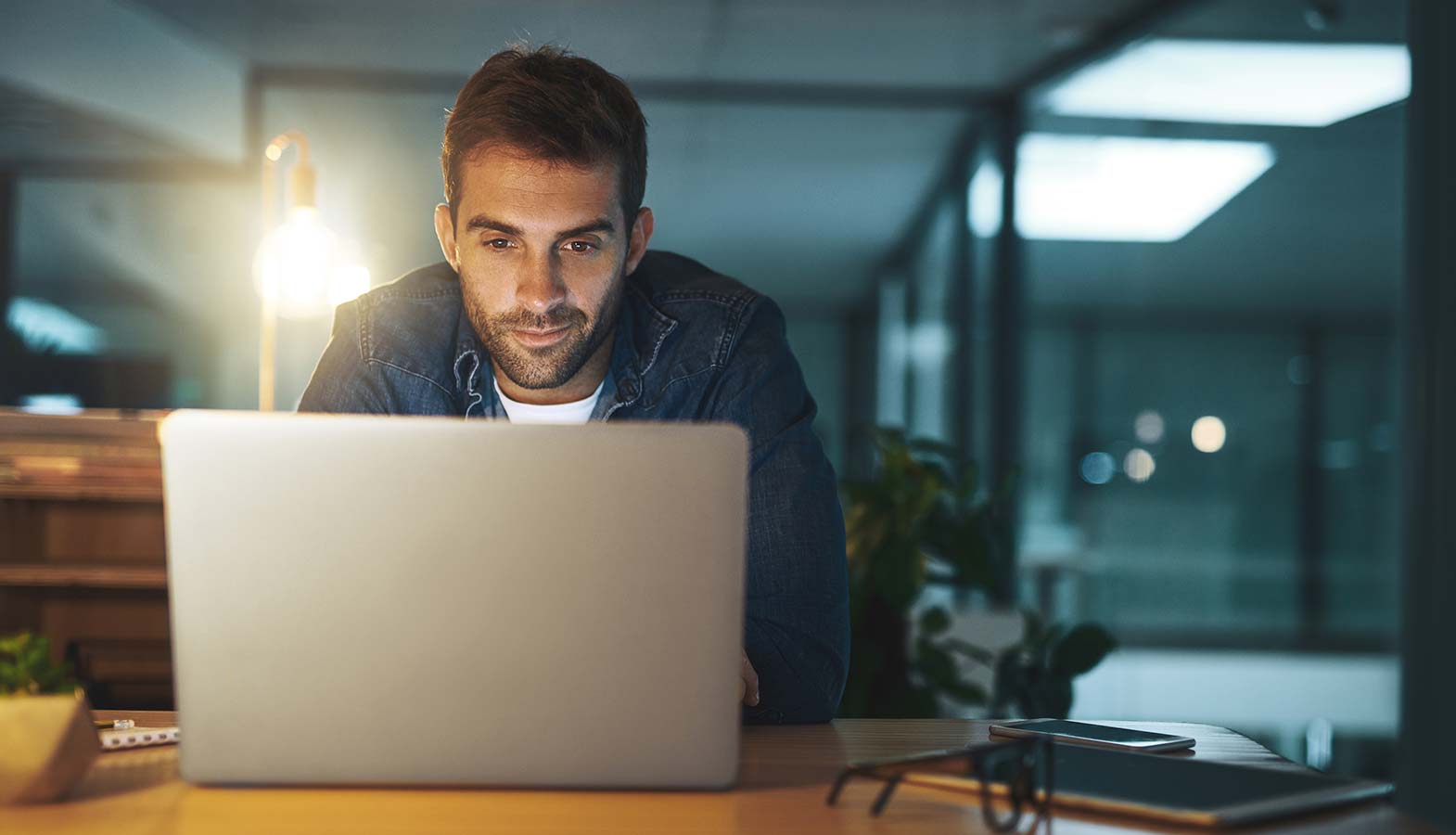 Person typing up a creative brief on a laptop