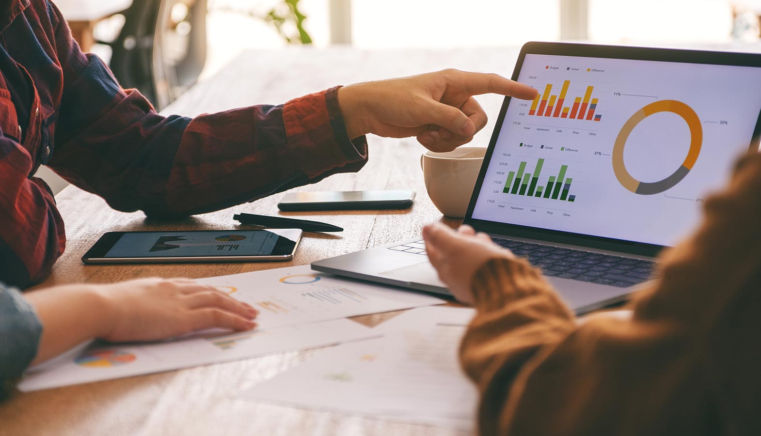 A close-up view of a laptop screen showcases detailed website analytics and performance metrics, highlighting key data points relevant to web development and digital marketing strategies. This image reflects the importance of tracking website traffic and optimization for effective digital solutions.